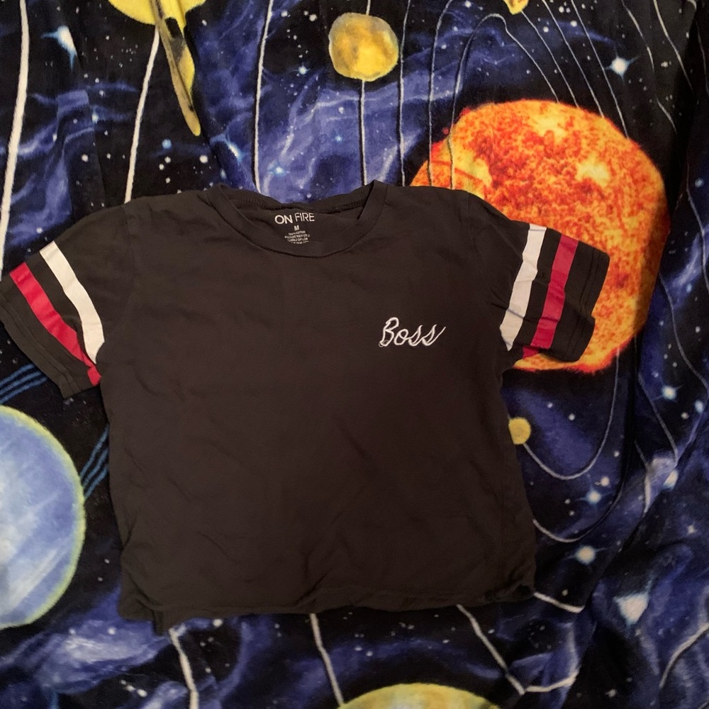 black crop top with red and white on the sleeves.brand is “on fire” 100% cotton.